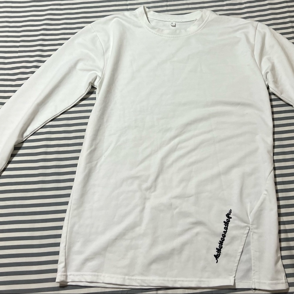 White long sleeve t shirt; kind of thick; good material; lettering on bottom